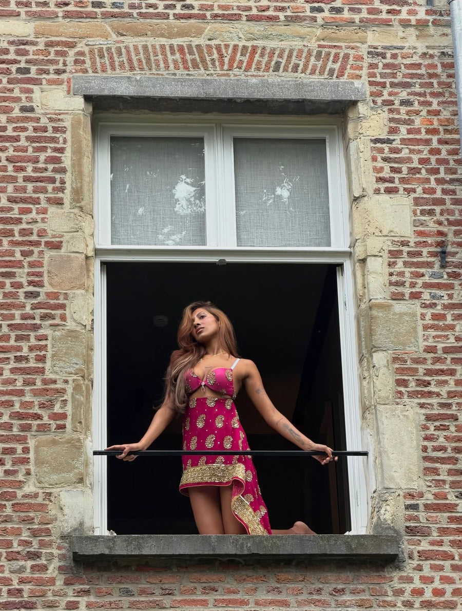 Lara Raj wearing a pink Rohmane embellished mini dress