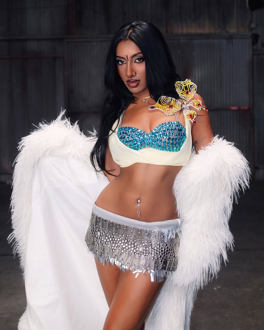 Lara Raj wearing a Rohmane crystal bra and fringed skirt